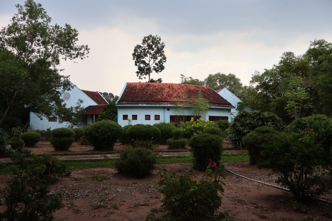 Charming traditional Vietnamese house surrounded by lush greenery in Ho Chi Minh City, Vietnam.